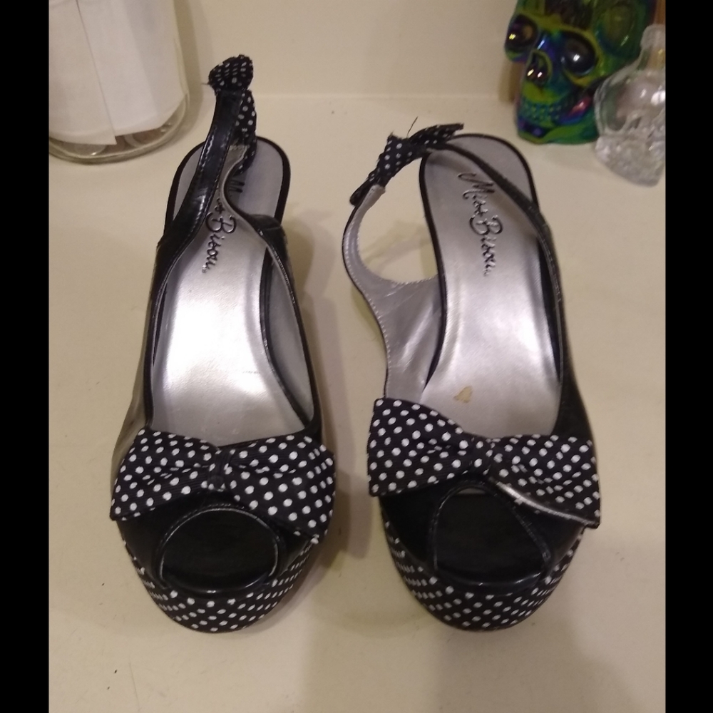 Miss Bisou sling back peep-toe platforms.